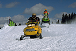 Snowmobilers race atop Grand Mesa in Colorado.